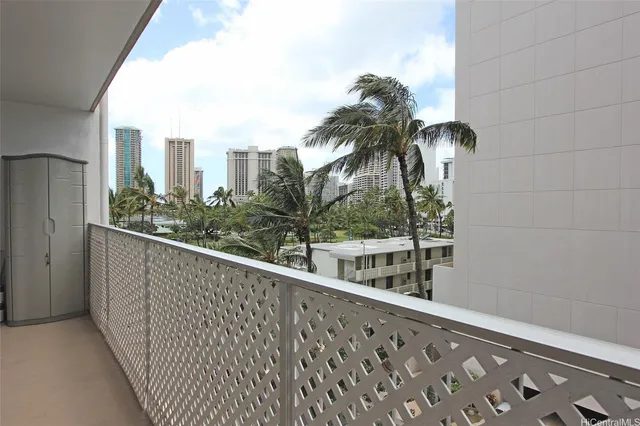 a view of balcony with a palm tree