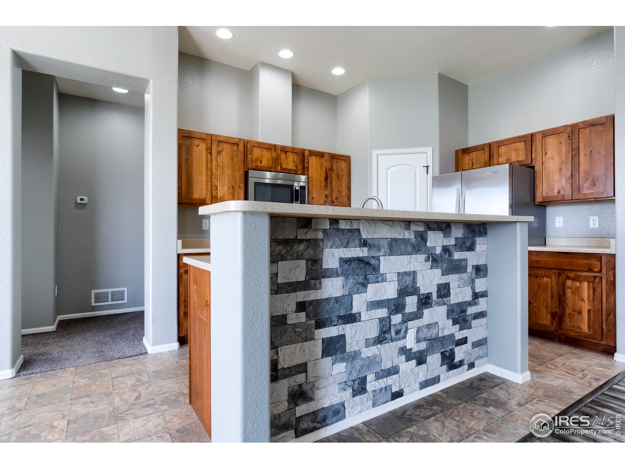 7424 23rd St Road Greeley, CO 80634 - Photo 10 of 40 Kitchen with breakfast bar