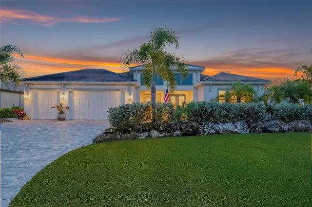 a front view of house with yard and green space