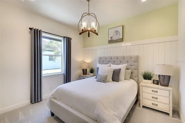 a bedroom with a bed and window