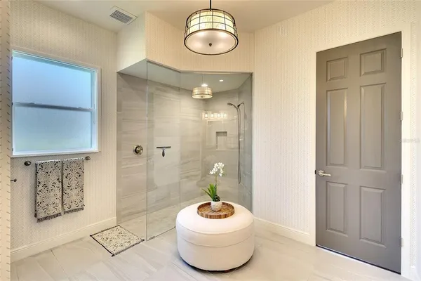 a bathroom with a toilet a sink and shower