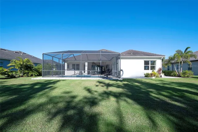 a front view of house with yard outdoor seating and green space