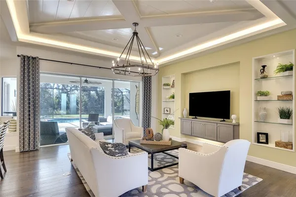 a living room with fireplace furniture and a flat screen tv