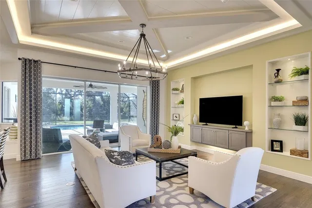 a living room with fireplace furniture and a flat screen tv