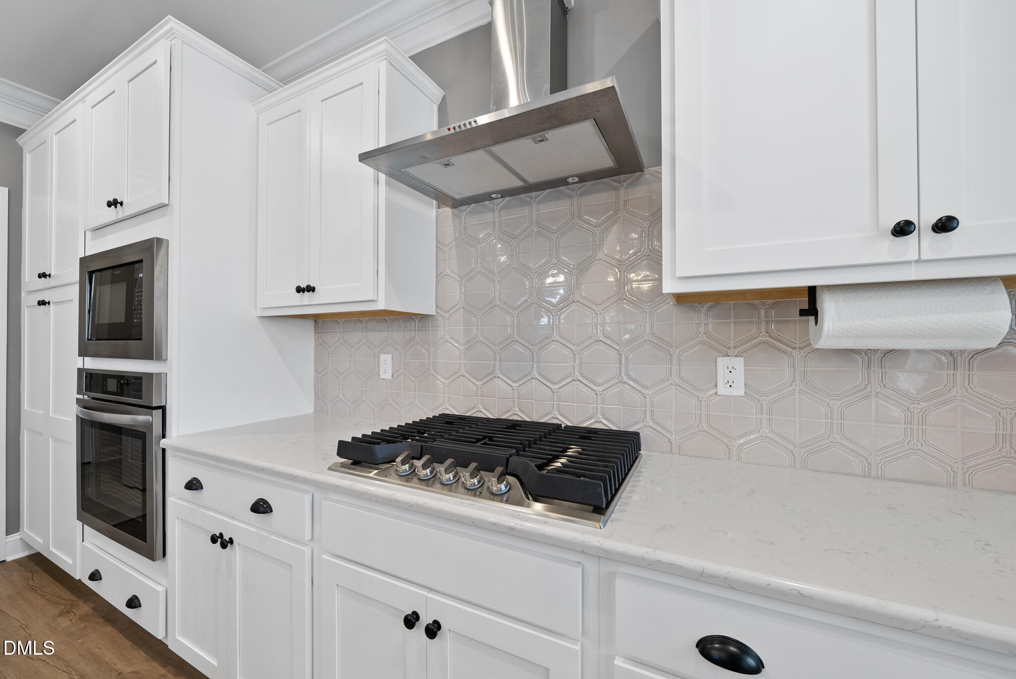 320 Kavanaugh Road Wake Forest, NC 27587 - Photo 12 of 32 a kitchen with granite countertop white cabinets and stainless steel appliances