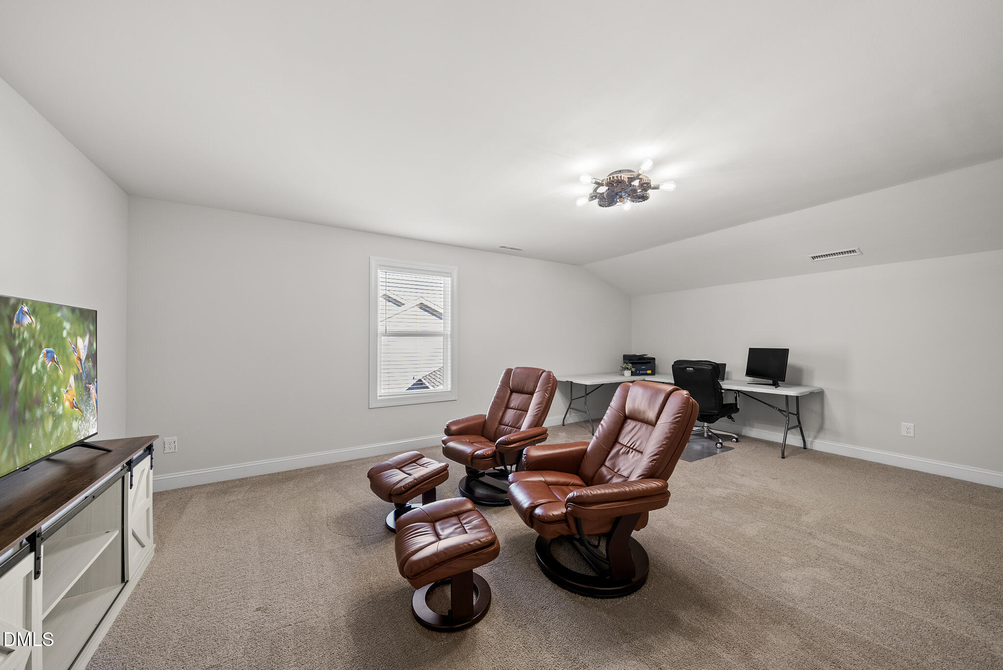 320 Kavanaugh Road Wake Forest, NC 27587 - Photo 27 of 32 a living room with furniture a window and a flat screen tv