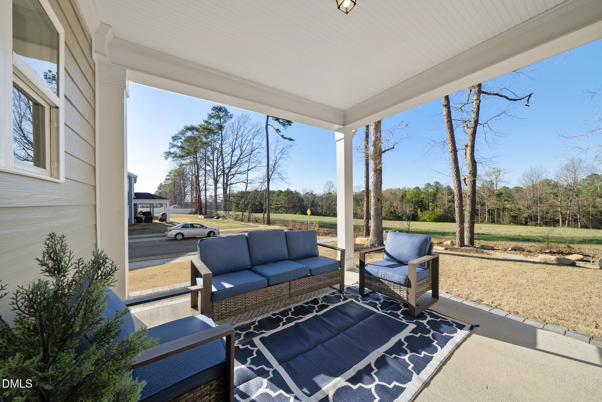 320 Kavanaugh Road Wake Forest, NC 27587 - Photo 28 of 32 a outdoor living space with furniture and a floor to ceiling window