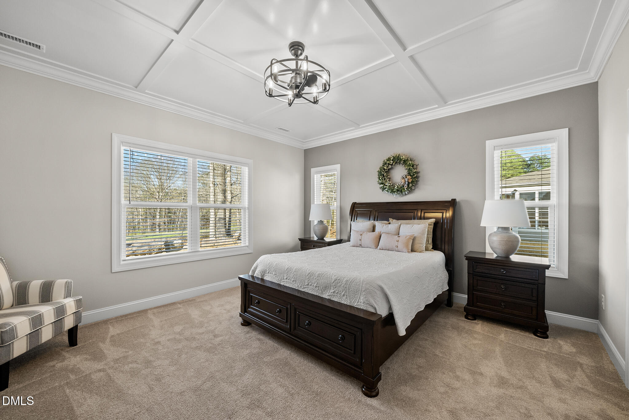 320 Kavanaugh Road Wake Forest, NC 27587 - Photo 5 of 32 a spacious bedroom with a bed and a chandelier