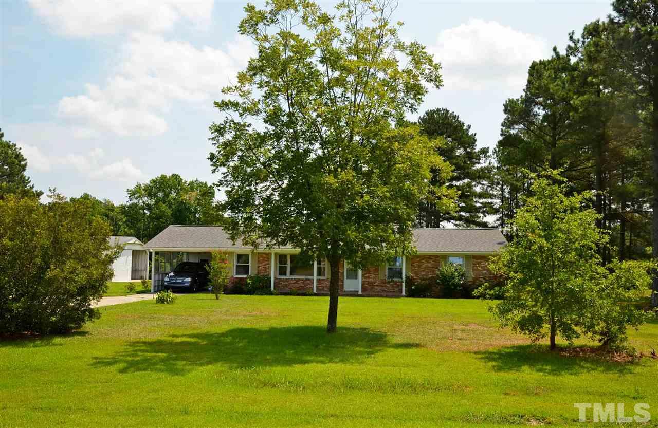 4228 Lassiter Road Wake Forest, NC 27587 - Photo 2 of 20 a front view of house with yard and green space