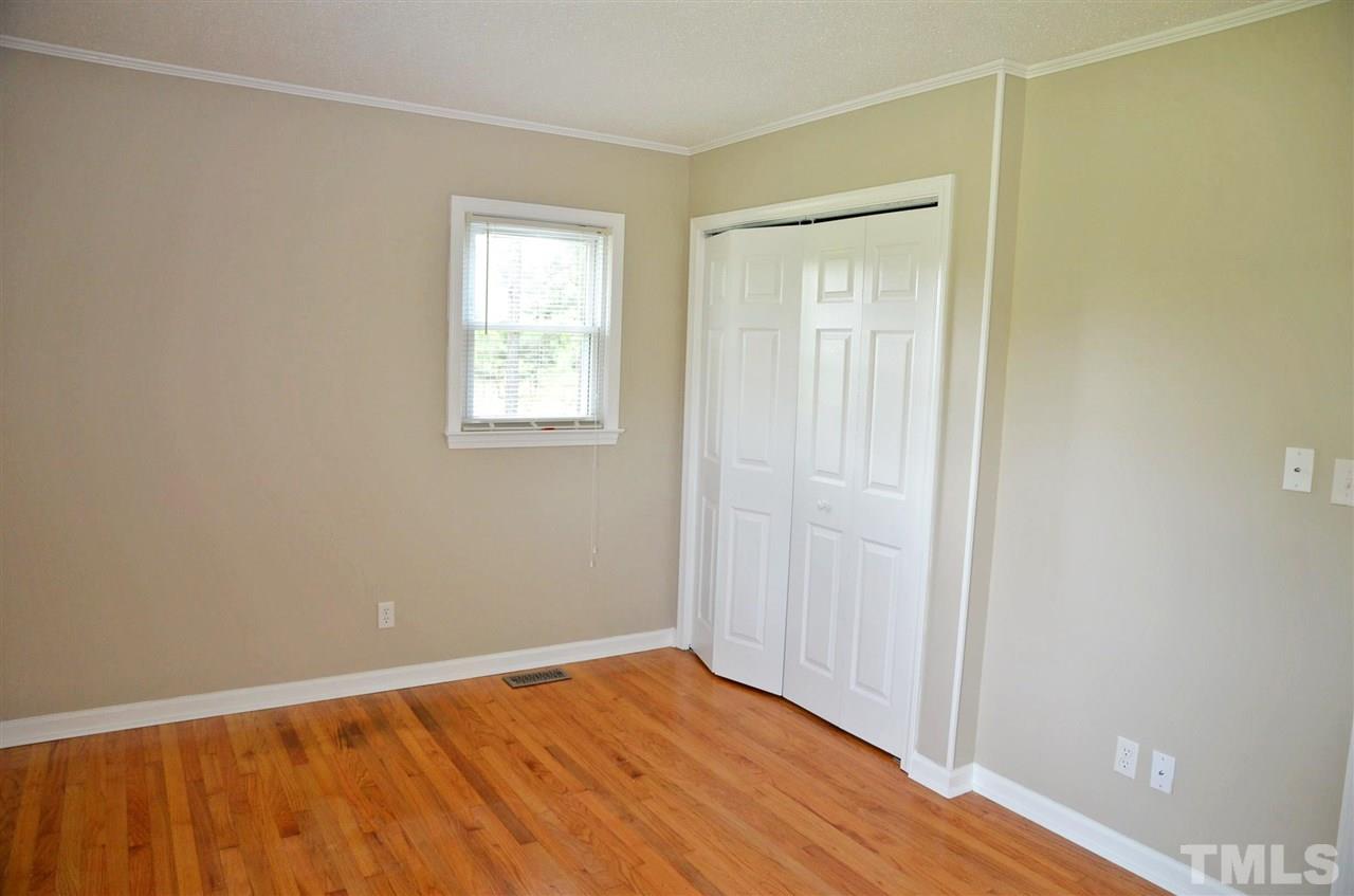 4228 Lassiter Road Wake Forest, NC 27587 - Photo 14 of 20 an empty room with wooden floor and windows