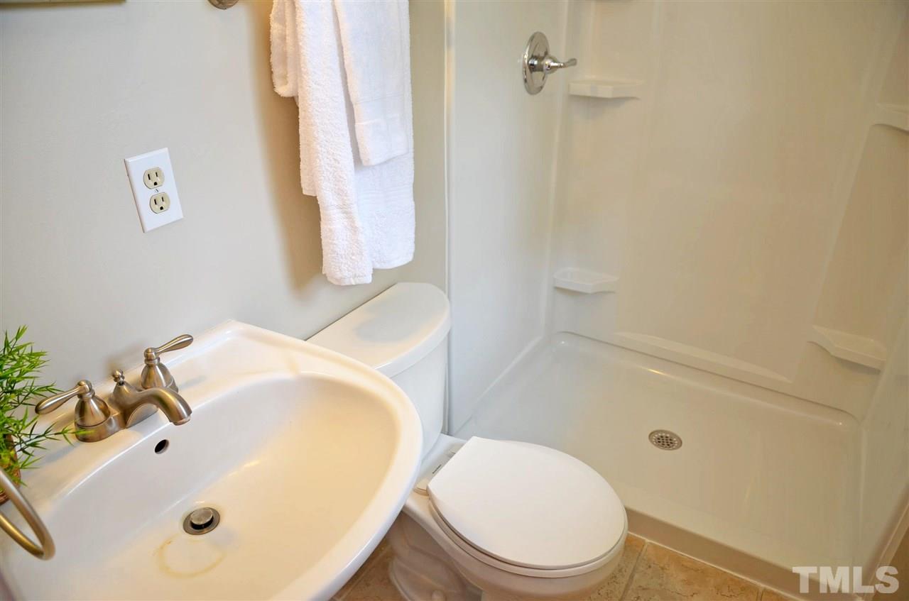 4228 Lassiter Road Wake Forest, NC 27587 - Photo 15 of 20 a bathroom with a sink and a mirror