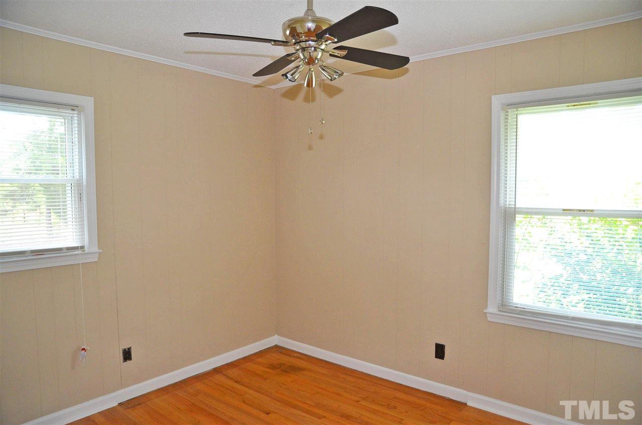 4228 Lassiter Road Wake Forest, NC 27587 - Photo 17 of 20 a view of a room with a window and wooden floor