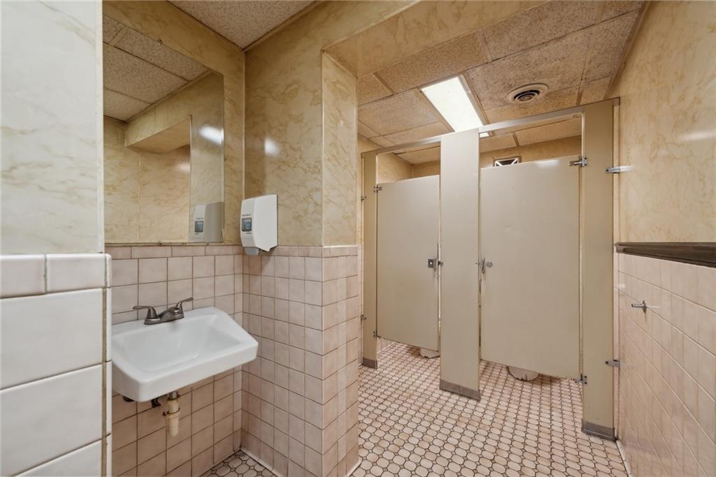 155 Smolleck Street Whitney, PA 15693 - Photo 12 of 39 a bathroom with a sink a toilet and shower