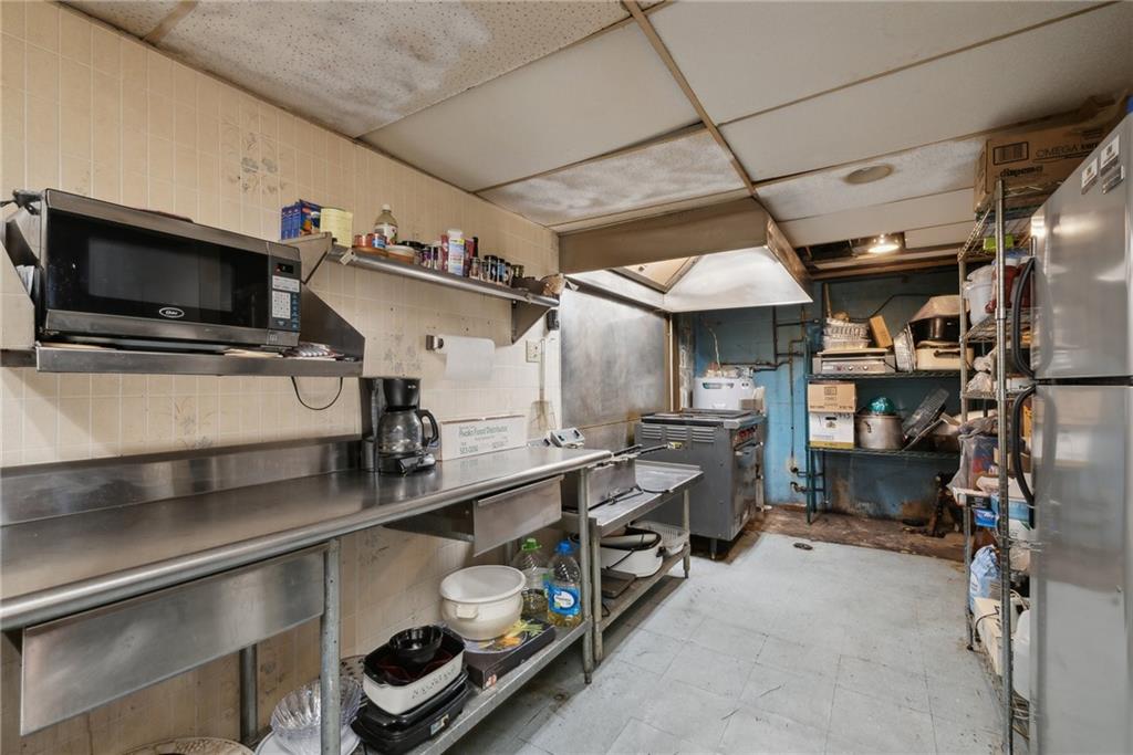 155 Smolleck Street Whitney, PA 15693 - Photo 17 of 39 a utility room with cabinets