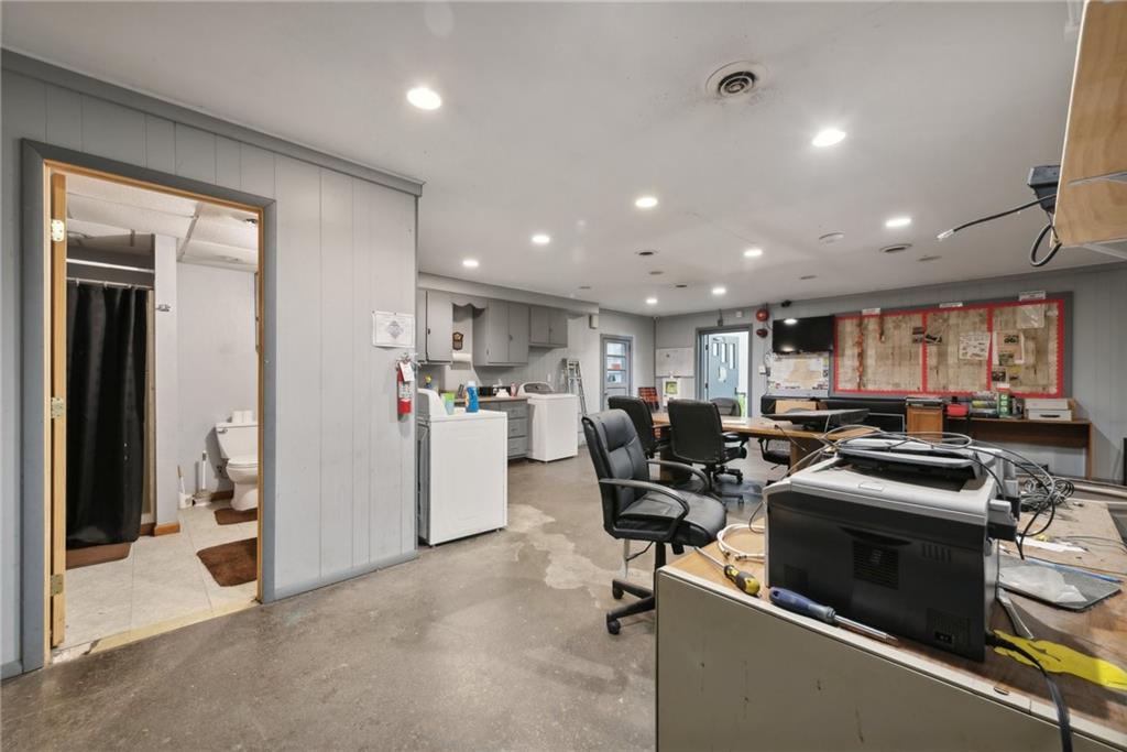 155 Smolleck Street Whitney, PA 15693 - Photo 26 of 39 a view of a kitchen with workspace and living room