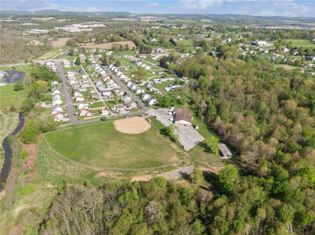 155 Smolleck Street Whitney, PA 15693 - Photo 38 of 39 a view of a lake with a city