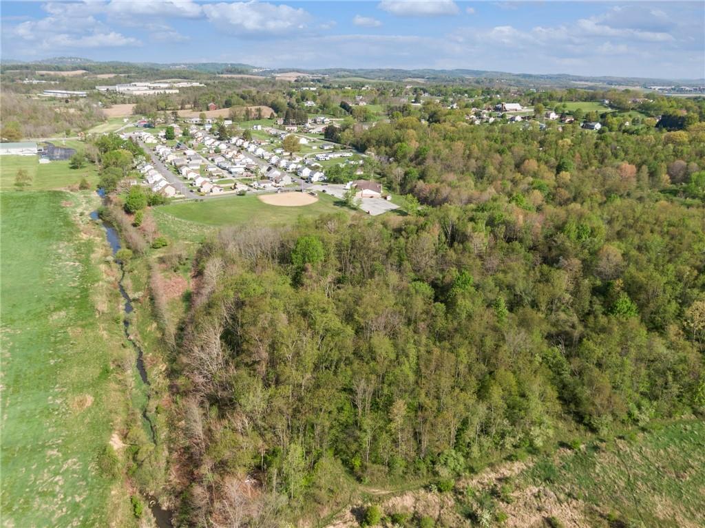 155 Smolleck Street Whitney, PA 15693 - Photo 39 of 39 a view of a city with lush green forest