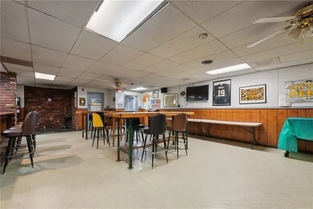 a living room with furniture a desk and chair