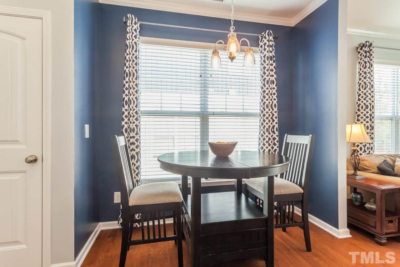 2427 Memory Ridge Drive Raleigh, NC 27606 - Photo 10 of 22 a view of a dining room with furniture and wooden floor