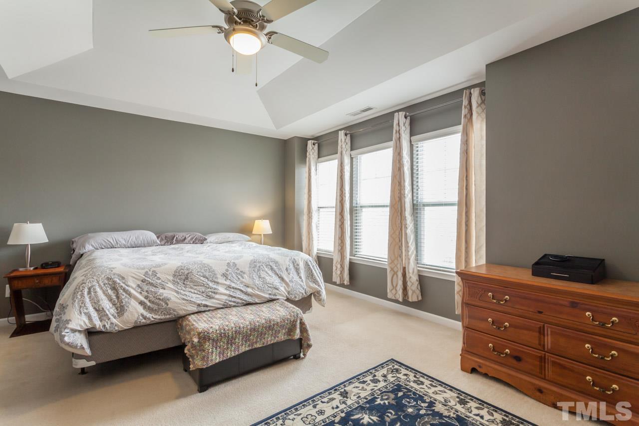 2427 Memory Ridge Drive Raleigh, NC 27606 - Photo 11 of 22 a bedroom with a bed and window