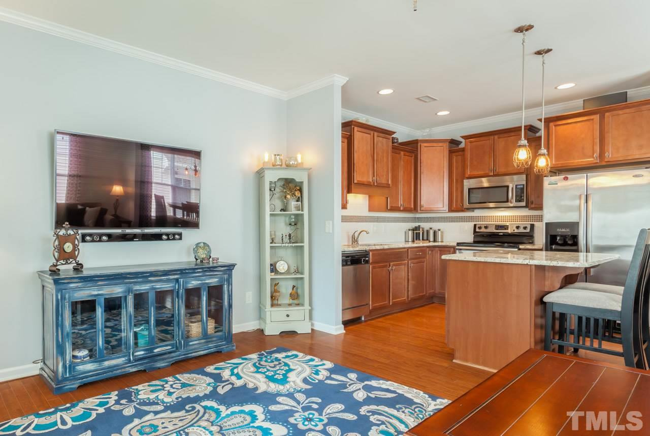 2427 Memory Ridge Drive Raleigh, NC 27606 - Photo 22 of 22 a kitchen with stainless steel appliances granite countertop a refrigerator stove top oven and sink