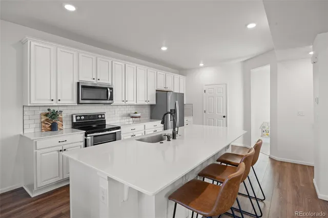 a living room with furniture a rug and a large window