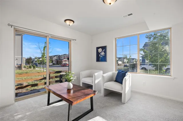 a spacious bedroom with a bed and a cabinets