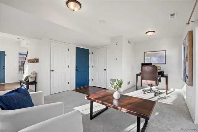 a spacious bedroom with a bed and a shower