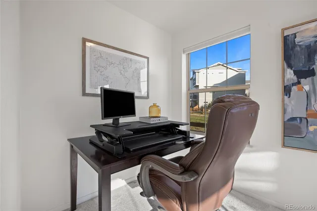a bathroom with a granite countertop double vanity sink and mirror