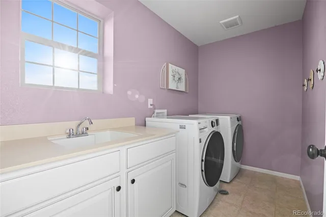 a view of front door and potted plants