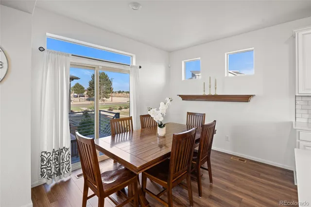 a view of an entryway with wooden floor and door