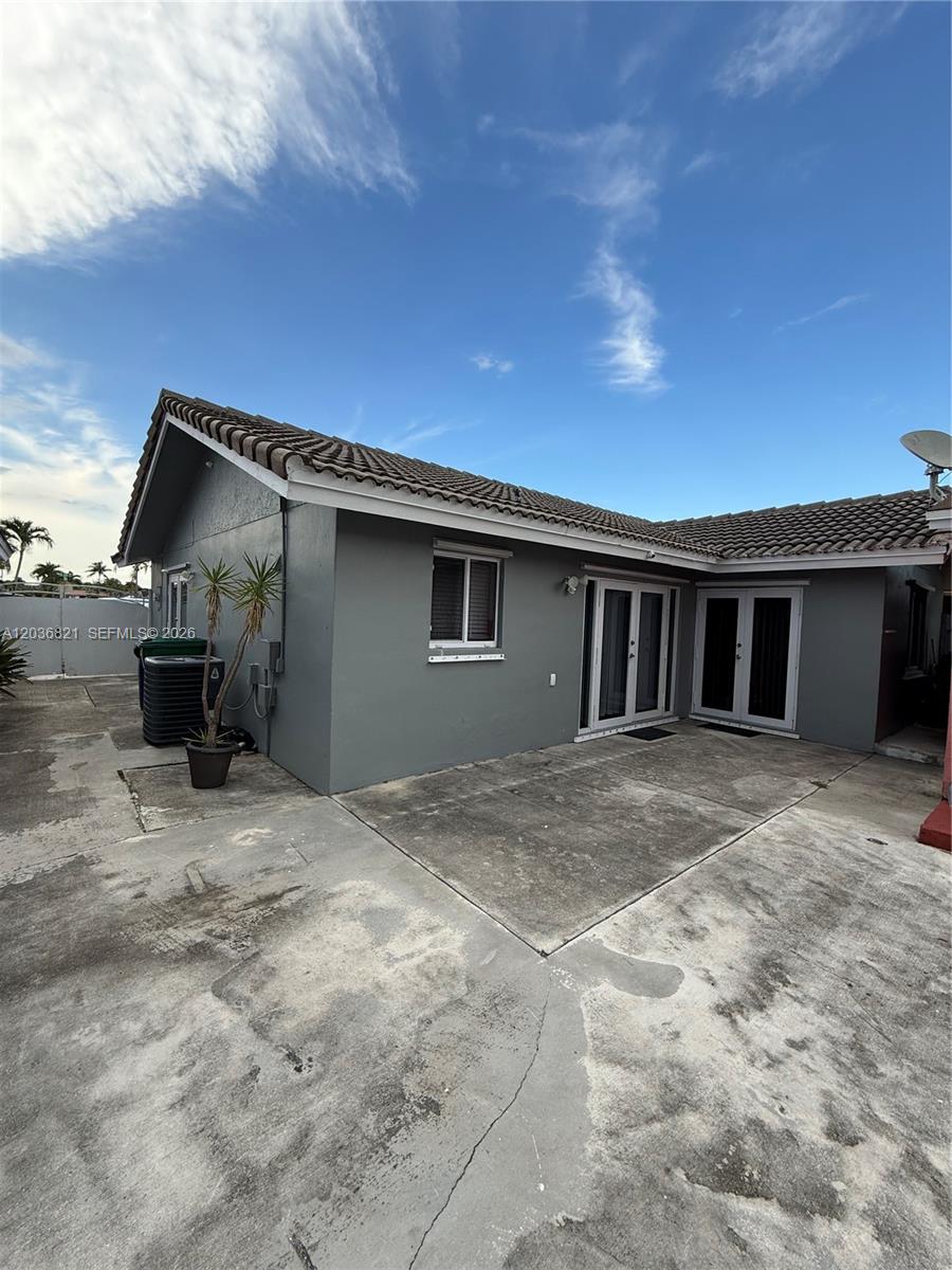14770 Southwest 60th Street Miami, FL 33193 - Photo 2 of 16 a view of a house with backyard space and balcony