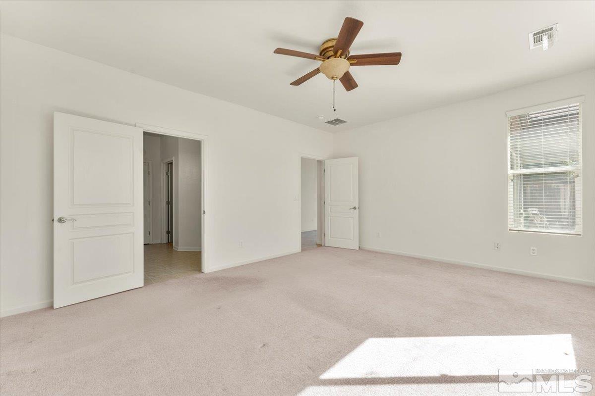 1125 Cliff Park Way Reno, NV 89523 - Photo 19 of 40 a view of a livingroom with a ceiling fan and window