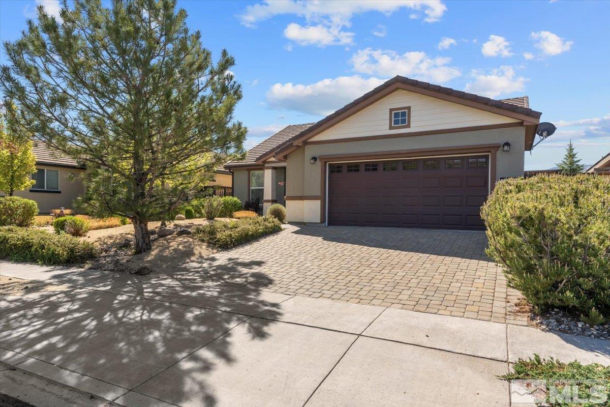 1125 Cliff Park Way Reno, NV 89523 - Photo 2 of 40 a front view of a house with a yard and garage