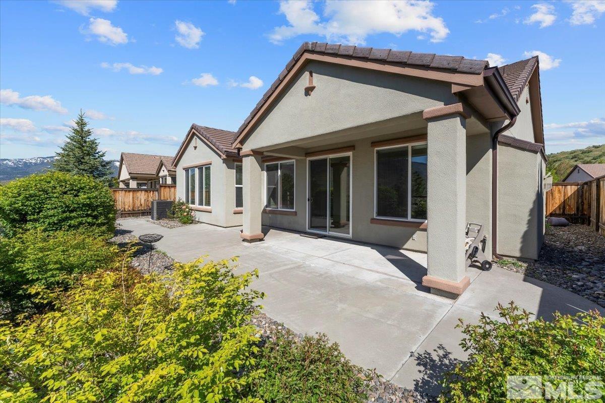 1125 Cliff Park Way Reno, NV 89523 - Photo 28 of 40 a view of a house with a small yard and potted plants