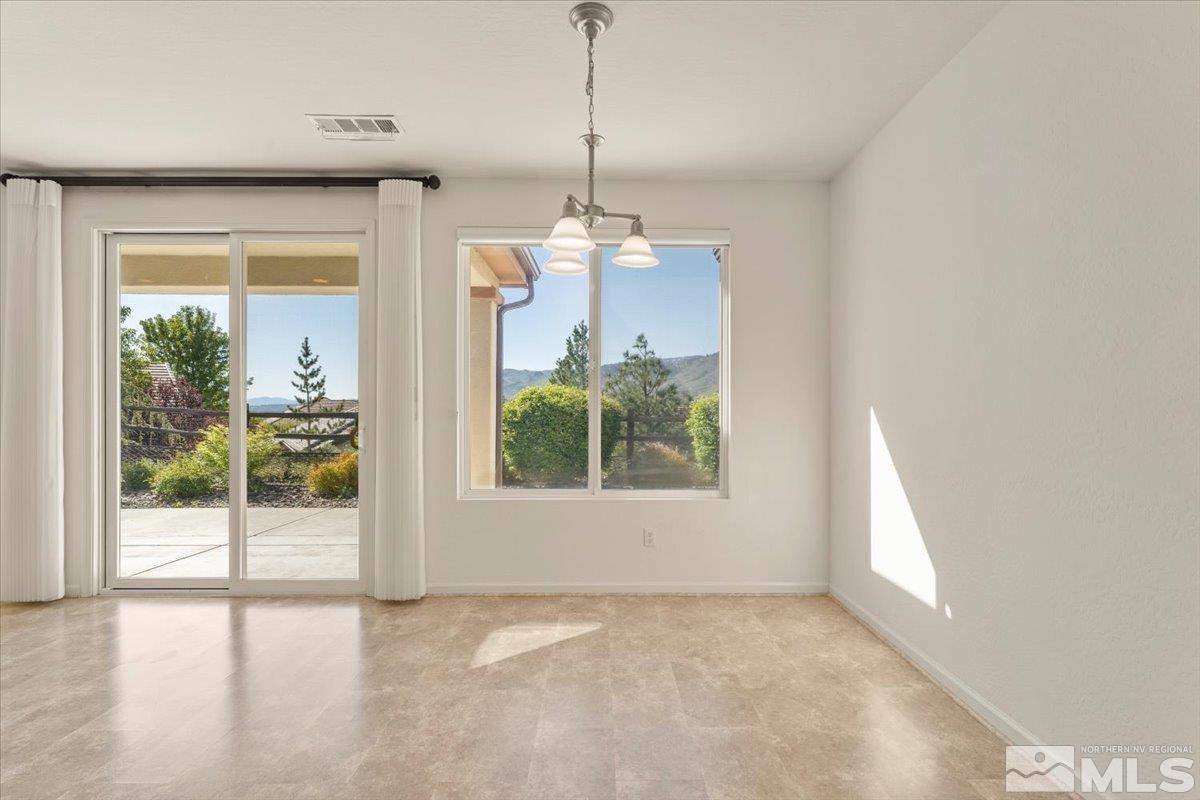1125 Cliff Park Way Reno, NV 89523 - Photo 9 of 40 a view of a room with a window and a chandelier