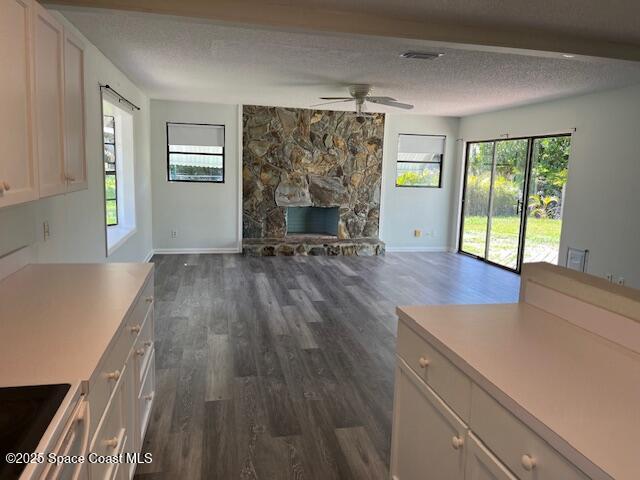 589 Michael Street Sebastian, FL 32958 - Photo 18 of 36 wooden floor in an empty room with a fireplace