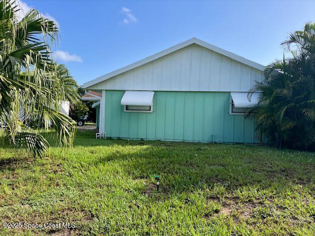 589 Michael Street Sebastian, FL 32958 - Photo 3 of 36 a backyard of a house with plants and entertaining space