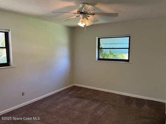 589 Michael Street Sebastian, FL 32958 - Photo 31 of 36 an empty room with a window and a fan