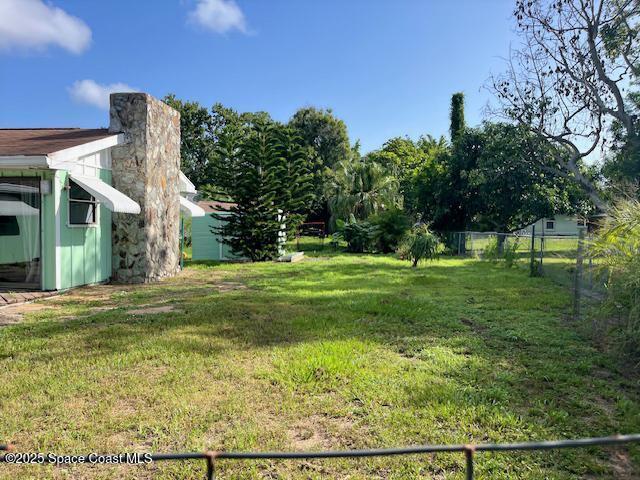 589 Michael Street Sebastian, FL 32958 - Photo 4 of 36 a view of a big yard with large trees