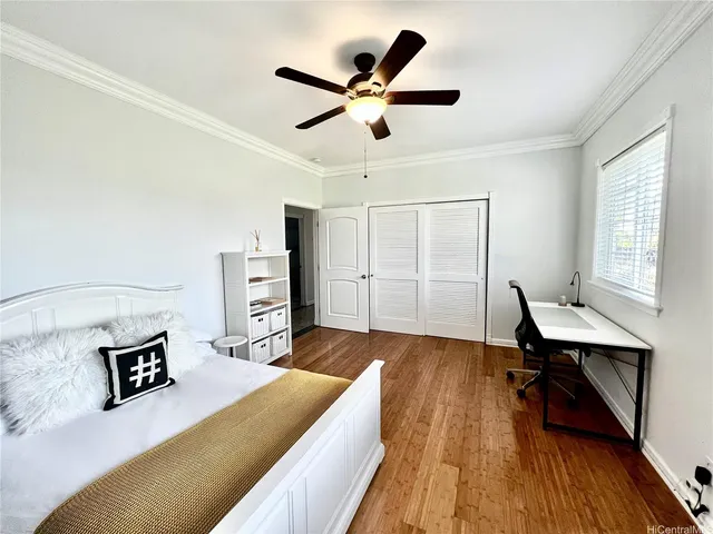 a bed room with a bed and a desk