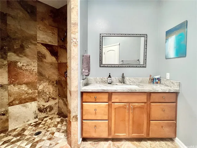 a bathroom with a sink and a mirror