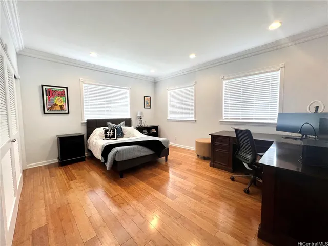 a bedroom with a bed and a desk