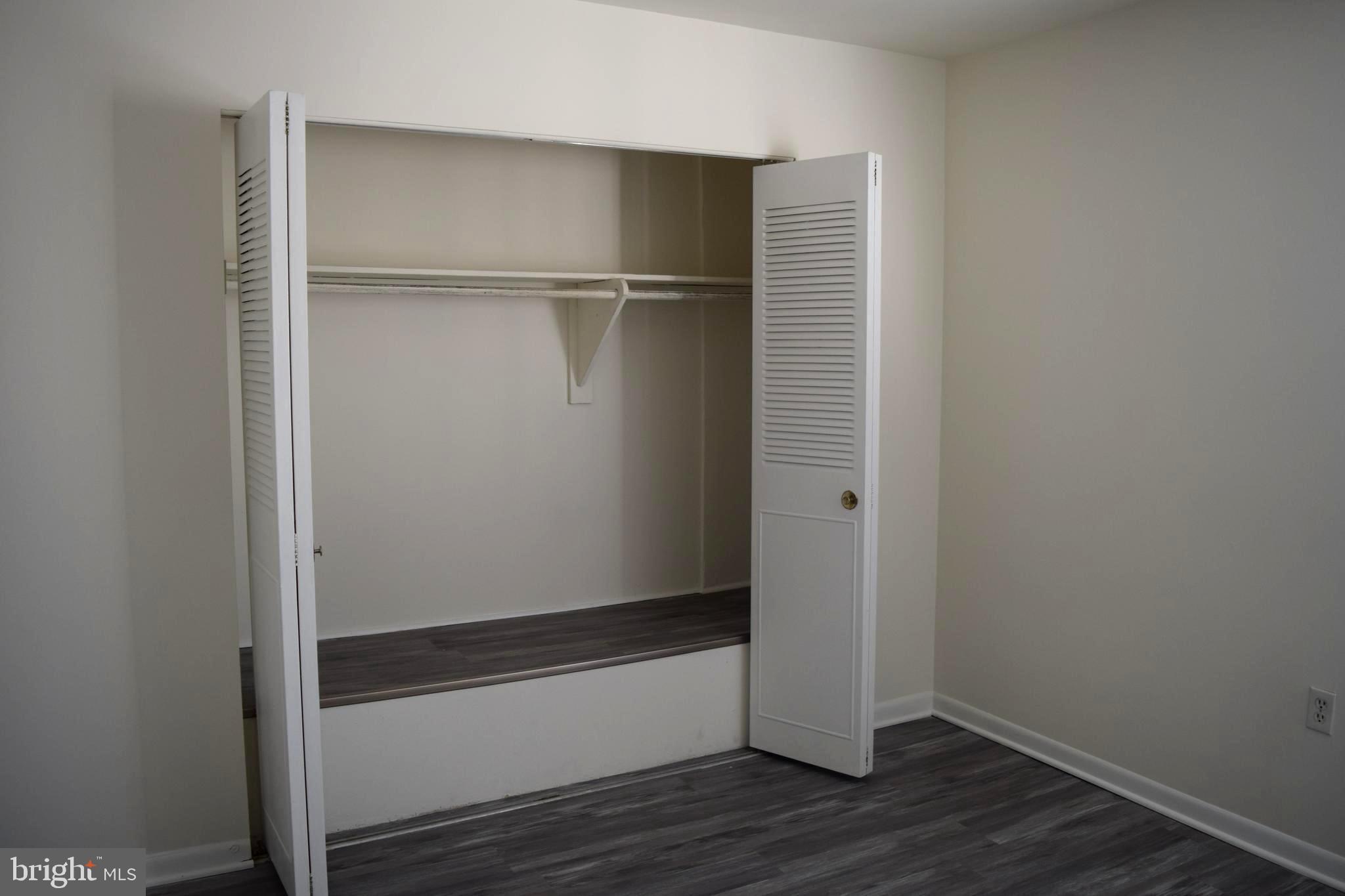 10566 Twin Rivers Road, Unit F1 Columbia, MD 21044 - Photo 18 of 44 a view of an empty walk in closet