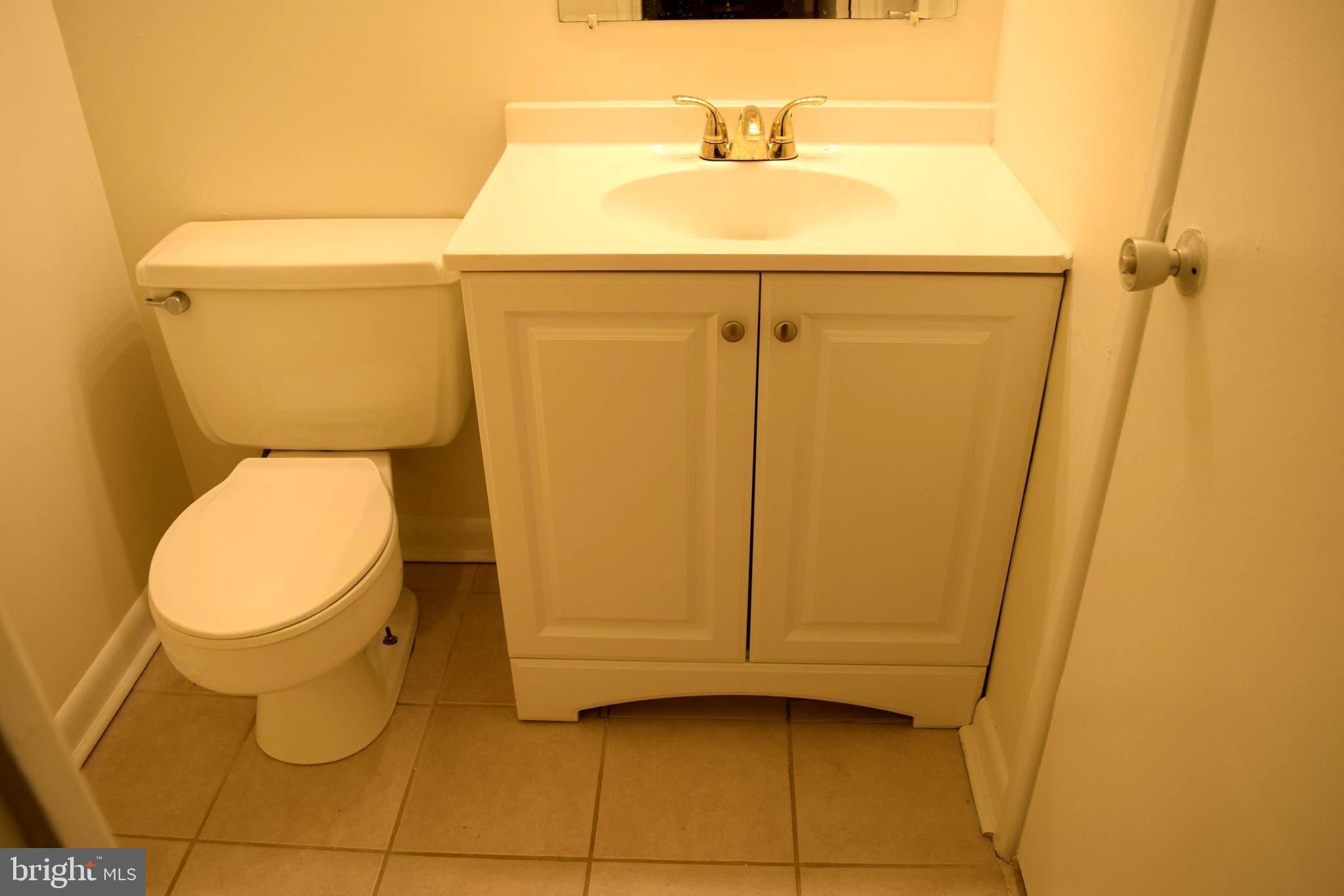 10566 Twin Rivers Road, Unit F1 Columbia, MD 21044 - Photo 27 of 44 a bathroom with a toilet and a sink