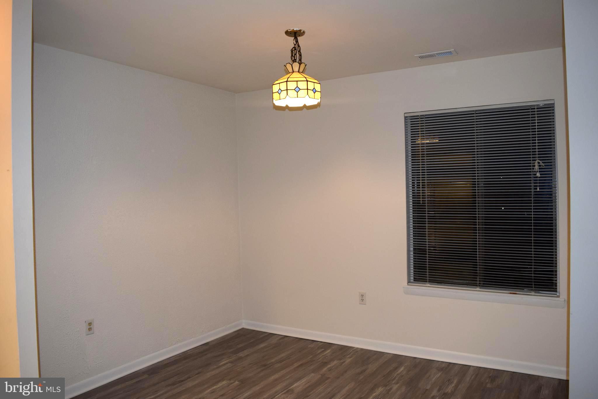10566 Twin Rivers Road, Unit F1 Columbia, MD 21044 - Photo 4 of 44 a view of an entryway with wooden floor