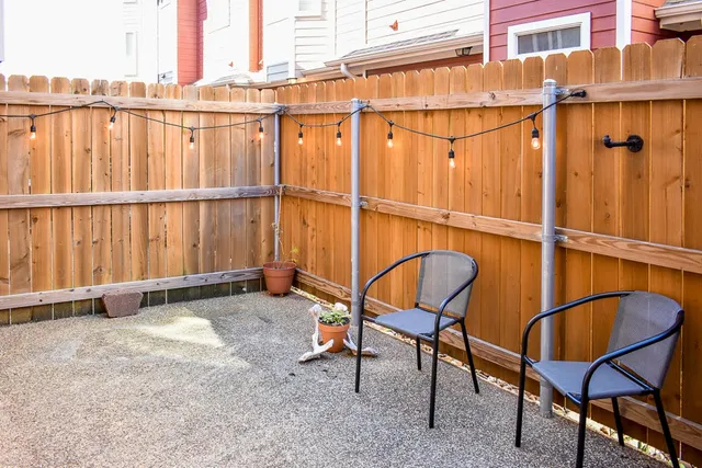 a view of a chairs and table in the patio