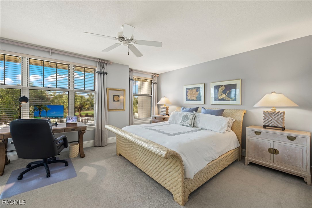 2619 Wulfert Road, Unit 1 Sanibel, FL 33957 - Photo 15 of 35 a bedroom with a bed and a large window