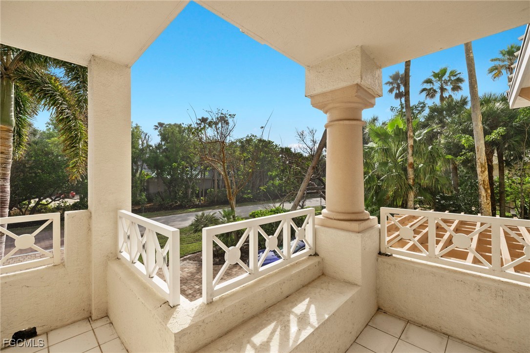 2619 Wulfert Road, Unit 1 Sanibel, FL 33957 - Photo 22 of 35 a view of a balcony with chairs
