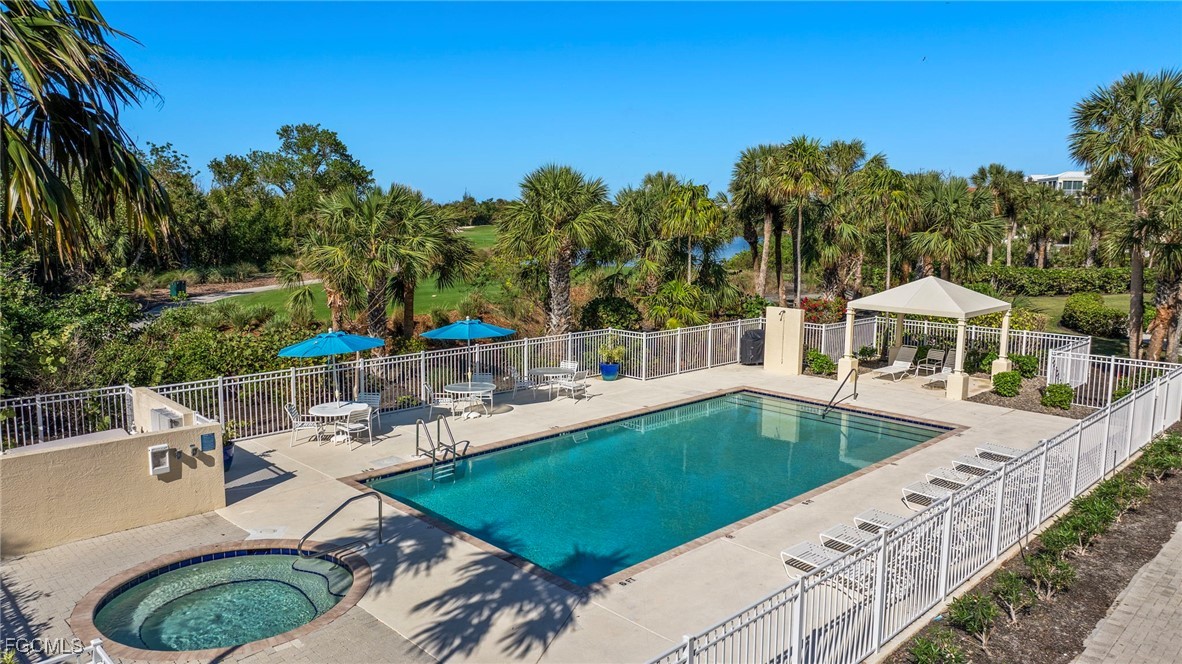 2619 Wulfert Road, Unit 1 Sanibel, FL 33957 - Photo 27 of 35 swimming pool view with a seating space